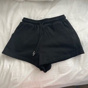 Two pairs of shorts, black and gray